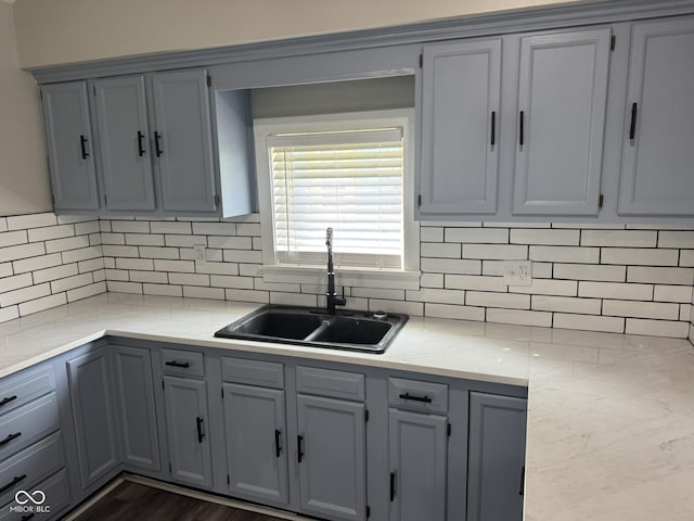 1006 Hurricane St, Franklin, IN 46131 - kitchen with gray cabinets, backsplash, and light stone countertops