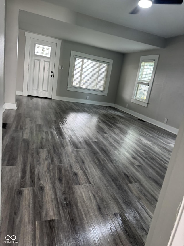1006 Hurricane St, Franklin, IN 46131 - unfurnished living room with dark wood-style floors and ceiling fan