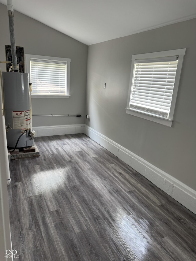 1006 Hurricane St, Franklin, IN 46131 - spare room featuring gas water heater, lofted ceiling, and wood finished floors