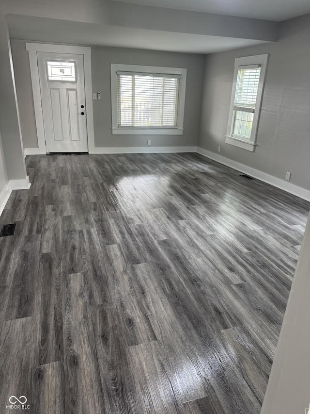 1006 Hurricane St, Franklin, IN 46131 - unfurnished living room with dark wood-type flooring