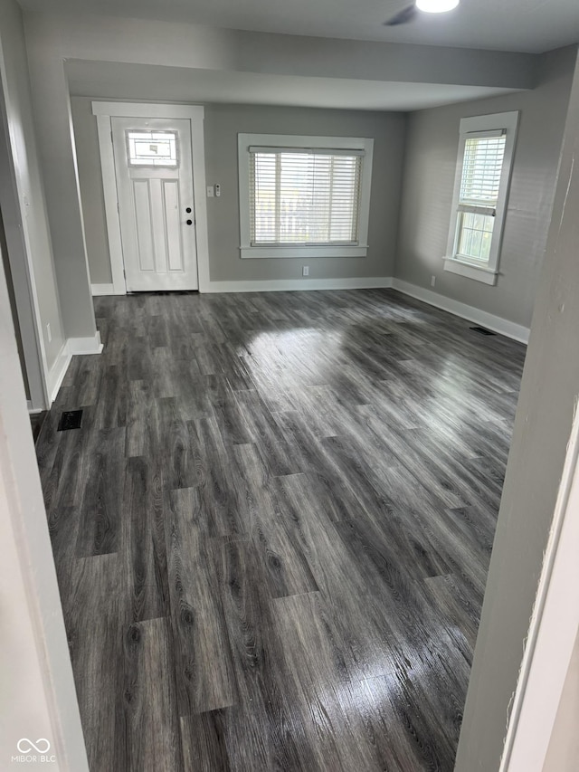 1006 Hurricane St, Franklin, IN 46131 - entryway featuring dark wood finished floors and baseboards
