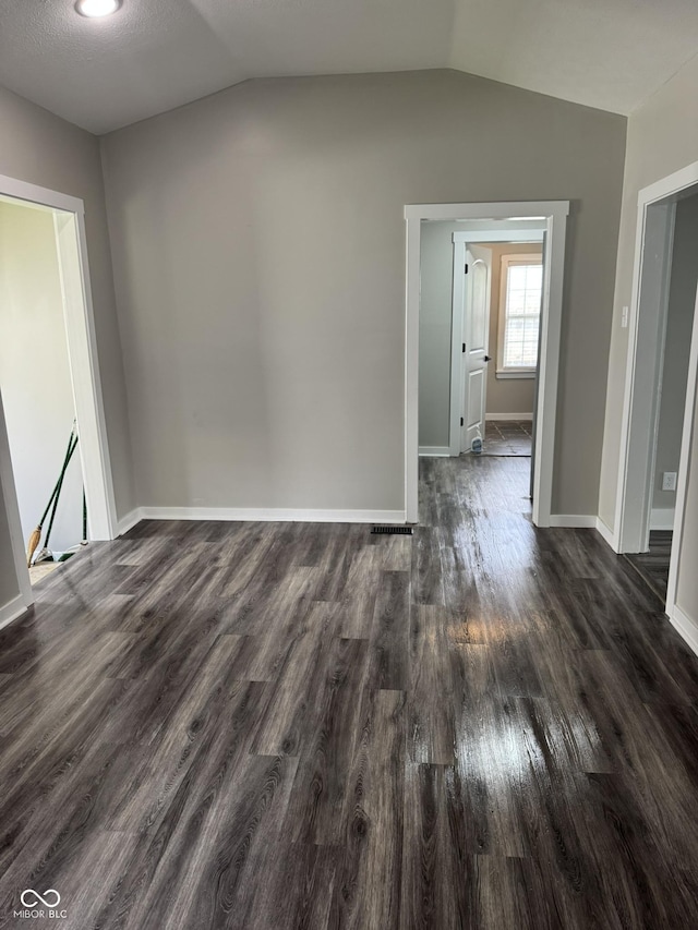 1006 Hurricane St, Franklin, IN 46131 - spare room with dark wood finished floors and vaulted ceiling