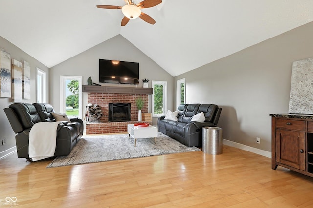 17138 Joliet Rd, Westfield, IN 46074 - living room featuring ceiling fan, a brick fireplace, light wood-type flooring, and high vaulted ceiling
