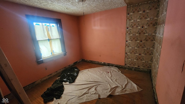 2157 Sugar Grove Ave, Indianapolis, IN 46202 - unfurnished room with a textured ceiling and baseboards