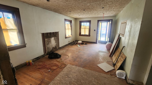 2157 Sugar Grove Ave, Indianapolis, IN 46202 - unfurnished living room featuring wood finished floors and a fireplace