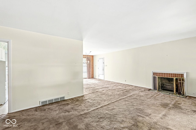 5841 N Parker Ave, Indianapolis, IN 46220 - unfurnished living room with carpet flooring, a fireplace, and a chandelier