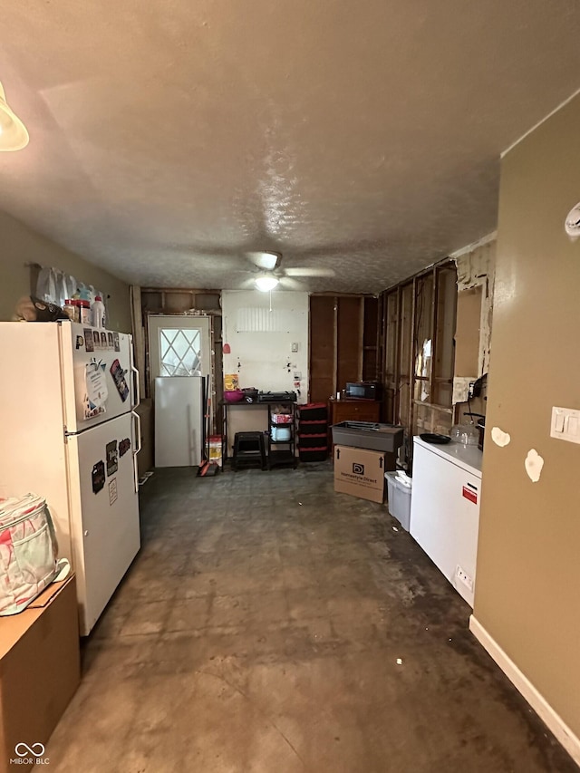 3440 Brewer Dr, Indianapolis, IN 46222 - kitchen featuring freestanding refrigerator, ceiling fan, and concrete flooring