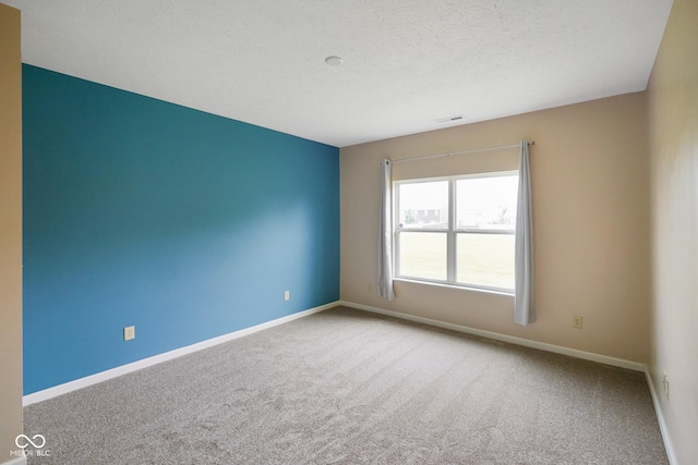 7715 Bolero Dr, Camby, IN 46113 - carpeted empty room featuring baseboards and a textured ceiling