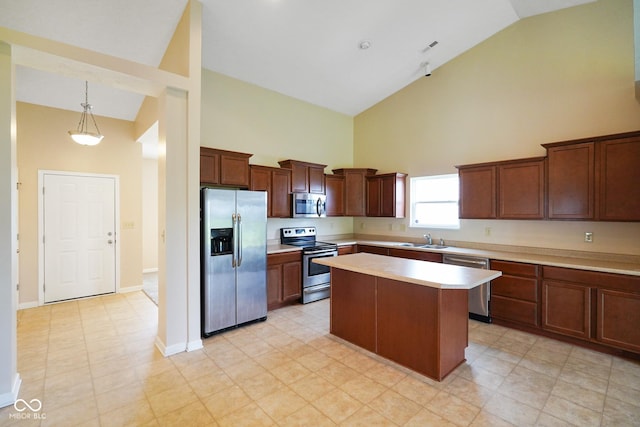 7715 Bolero Dr, Camby, IN 46113 - kitchen featuring stainless steel appliances, high vaulted ceiling, light countertops, a center island, and pendant lighting