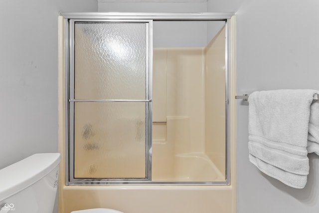 7616 Derrek Pl, Indianapolis, IN 46219 - full bathroom featuring toilet and combined bath / shower with glass door