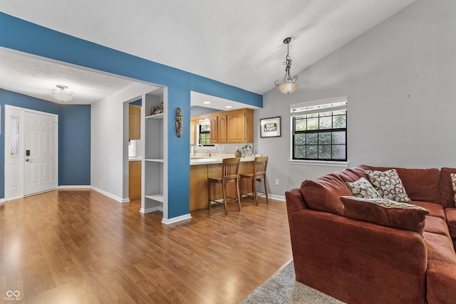 7616 Derrek Pl, Indianapolis, IN 46219 - living room featuring wood finished floors and lofted ceiling