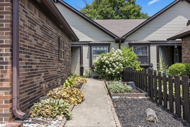 7616 Derrek Pl, Indianapolis, IN 46219 - entrance to property featuring brick siding and roof with shingles