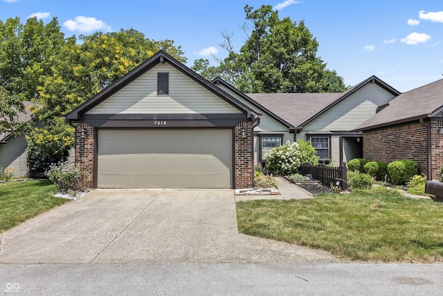 7616 Derrek Pl, Indianapolis, IN 46219 - single story home with brick siding, a garage, driveway, and a front yard