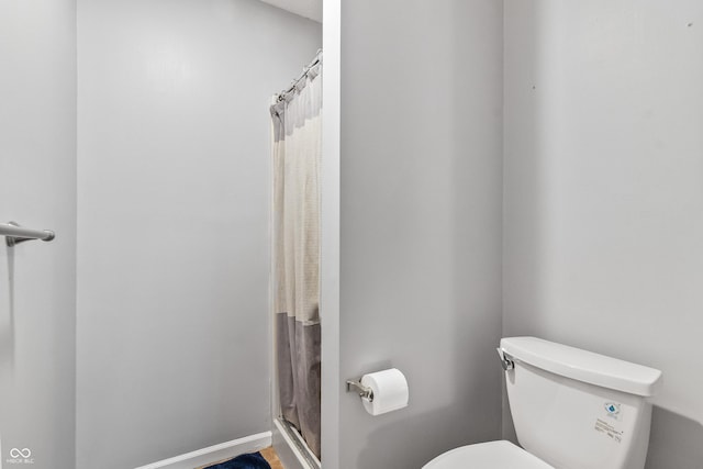 7616 Derrek Pl, Indianapolis, IN 46219 - bathroom with toilet and a shower with shower curtain
