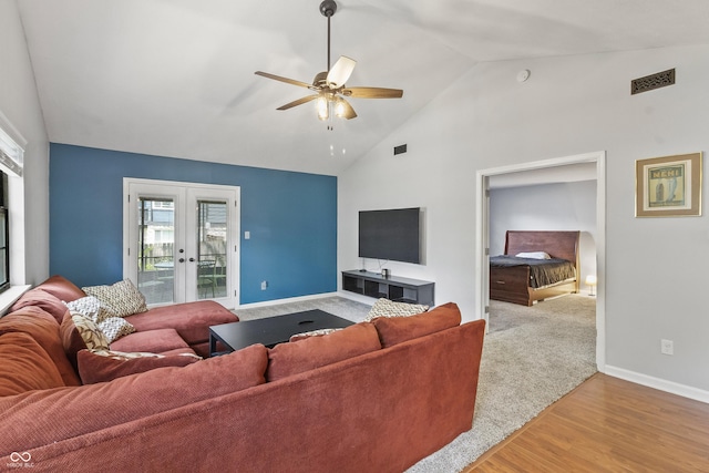 7616 Derrek Pl, Indianapolis, IN 46219 - living area featuring french doors, a ceiling fan, wood finished floors, and high vaulted ceiling