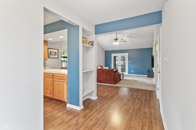7616 Derrek Pl, Indianapolis, IN 46219 - hall with french doors, wood finished floors, and built in shelves