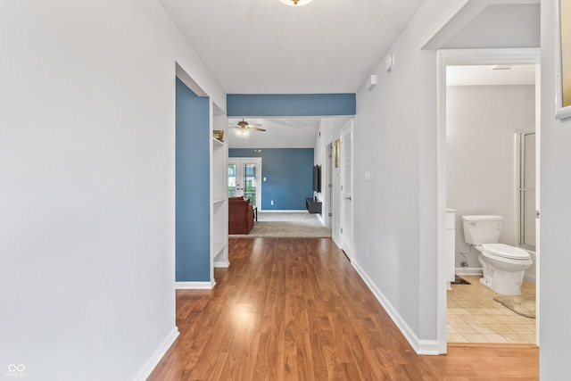 7616 Derrek Pl, Indianapolis, IN 46219 - hall with wood finished floors and baseboards