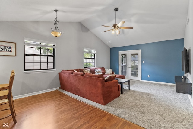 7616 Derrek Pl, Indianapolis, IN 46219 - living room featuring a ceiling fan, french doors, wood finished floors, and high vaulted ceiling