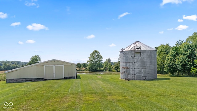 3249 N Slab Rd, Austin, IN 47102 - view of green lawn featuring an outbuilding and a water view