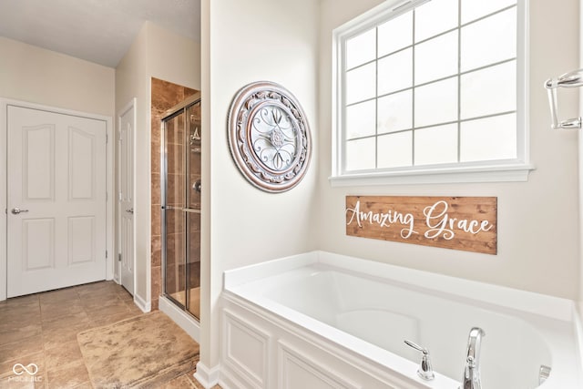 13327 Hockley Dr, Fishers, IN 46037 - bathroom featuring a bath, a stall shower, and plenty of natural light