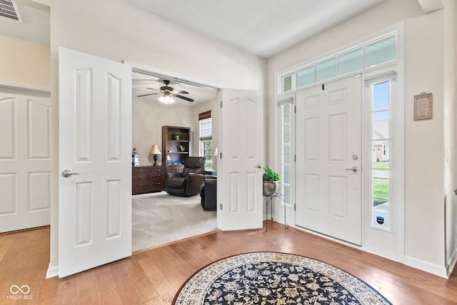 13327 Hockley Dr, Fishers, IN 46037 - entrance foyer with wood finished floors, plenty of natural light, and a ceiling fan