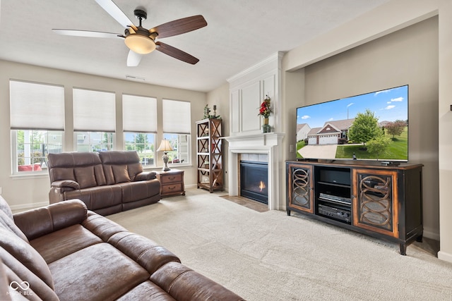 13327 Hockley Dr, Fishers, IN 46037 - living room with carpet, a fireplace, and a ceiling fan