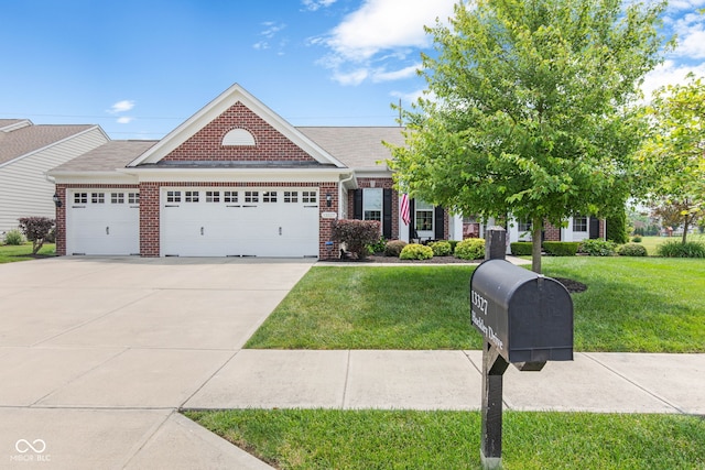 13327 Hockley Dr, Fishers, IN 46037 - view of front of house featuring brick siding, a garage, a front yard, and concrete driveway