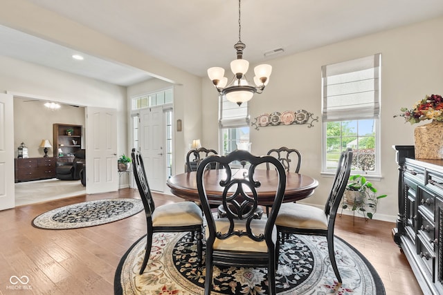 13327 Hockley Dr, Fishers, IN 46037 - dining area with wood finished floors, a chandelier, and recessed lighting