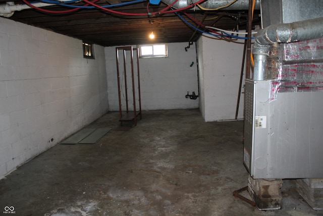 1703 E 34th St, Indianapolis, IN 46218 - unfinished basement with heating unit and concrete block wall