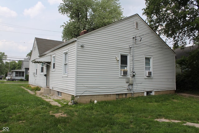 1703 E 34th St, Indianapolis, IN 46218 - view of home's exterior featuring a yard and cooling unit