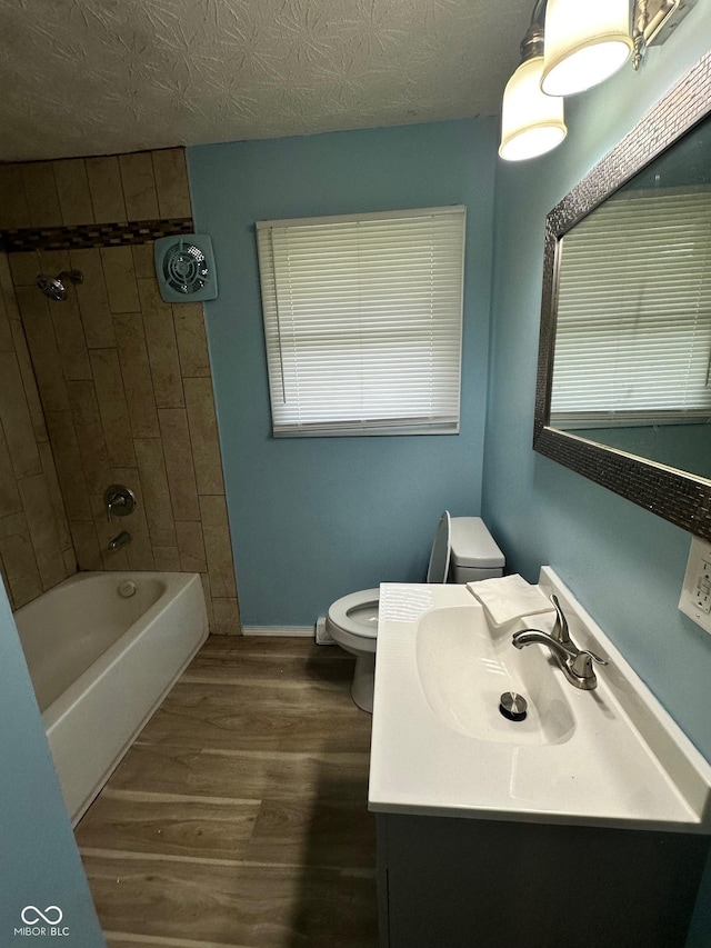 4908 Elmhurst Dr, Indianapolis, IN 46226 - full bathroom featuring wood finished floors, vanity, and bathing tub / shower combination