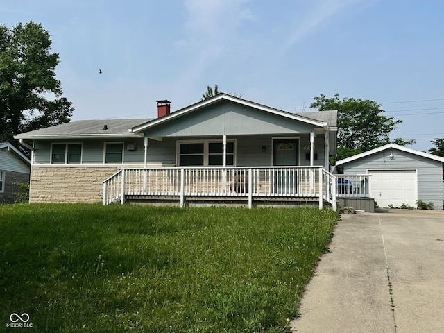 4908 Elmhurst Dr, Indianapolis, IN 46226 - view of front of property with an outdoor structure, concrete driveway, a detached garage, covered porch, and a chimney