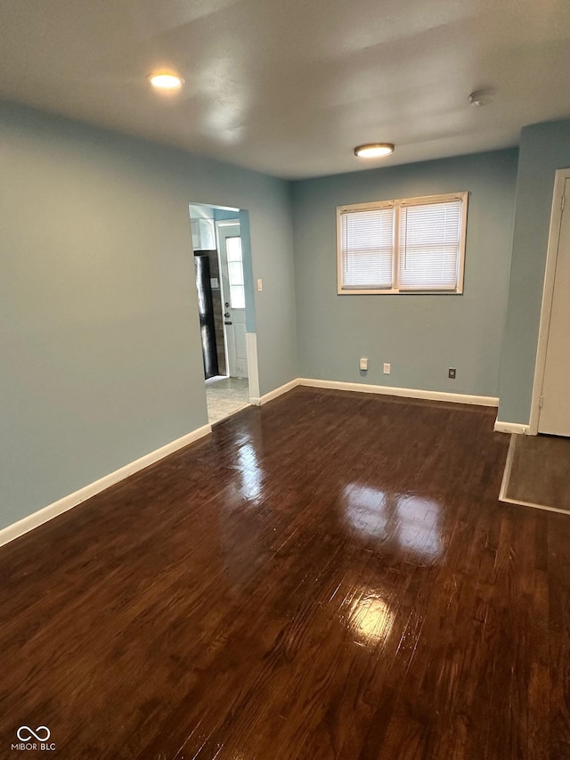4908 Elmhurst Dr, Indianapolis, IN 46226 - unfurnished room featuring wood finished floors and plenty of natural light
