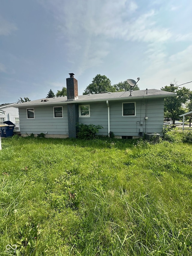 4908 Elmhurst Dr, Indianapolis, IN 46226 - back of house with a chimney