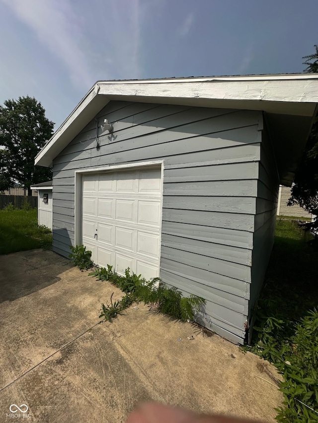 4908 Elmhurst Dr, Indianapolis, IN 46226 - detached garage featuring driveway