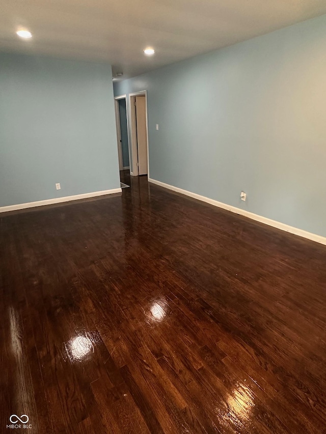 4908 Elmhurst Dr, Indianapolis, IN 46226 - unfurnished room with dark wood-type flooring and recessed lighting