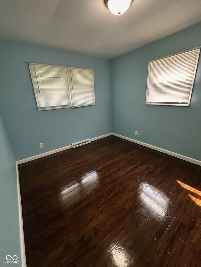 4908 Elmhurst Dr, Indianapolis, IN 46226 - empty room featuring wood-type flooring and healthy amount of natural light