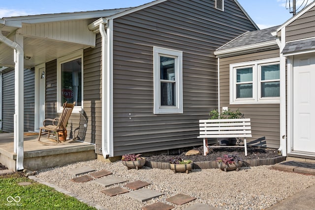 900 N College St N, Veedersburg, IN 47987 - view of property exterior featuring a porch and a shingled roof