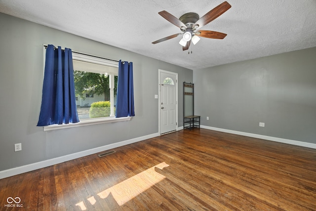 900 N College St N, Veedersburg, IN 47987 - spare room with a textured ceiling, a ceiling fan, and wood finished floors