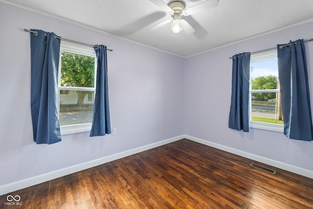 900 N College St N, Veedersburg, IN 47987 - spare room with healthy amount of natural light, wood finished floors, a textured ceiling, ceiling fan, and ornamental molding