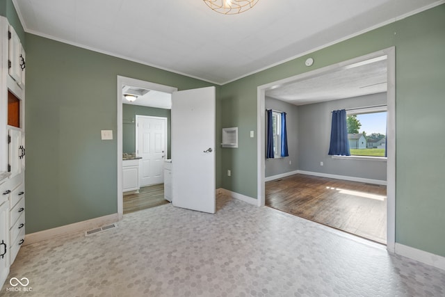 900 N College St N, Veedersburg, IN 47987 - unfurnished bedroom with crown molding and ensuite bathroom