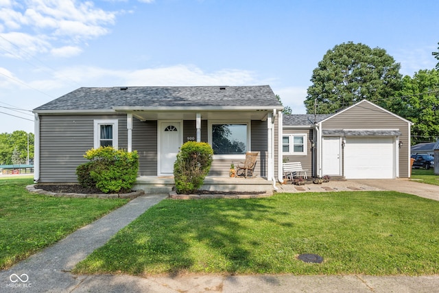 900 N College St N, Veedersburg, IN 47987 - bungalow-style house featuring covered porch, a garage, concrete driveway, and a front yard