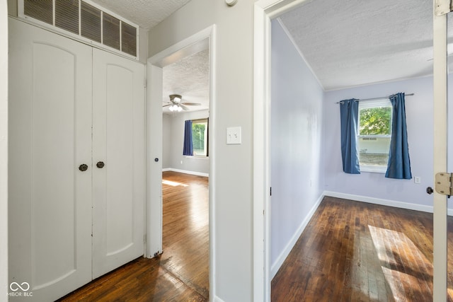 900 N College St N, Veedersburg, IN 47987 - corridor featuring a textured ceiling, dark wood finished floors, and ornamental molding
