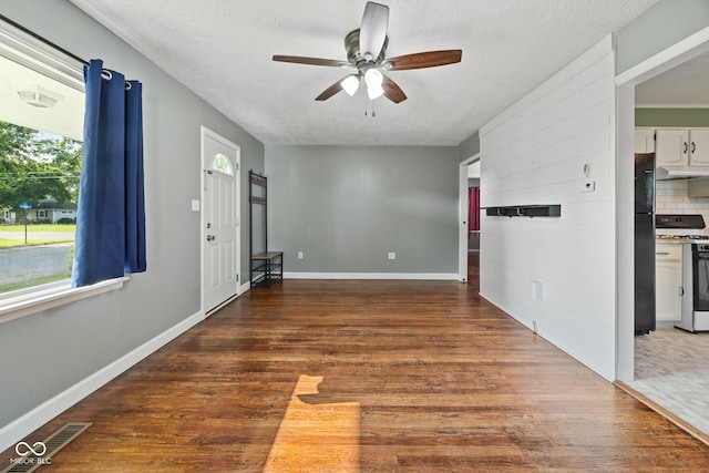 900 N College St N, Veedersburg, IN 47987 - spare room with ceiling fan, a textured ceiling, and wood finished floors