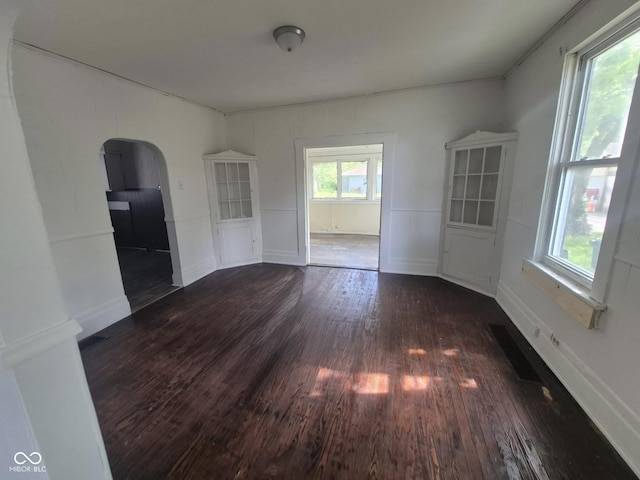 711 W Centennial Ave, Muncie, IN 47303 - unfurnished dining area with arched walkways and wood finished floors