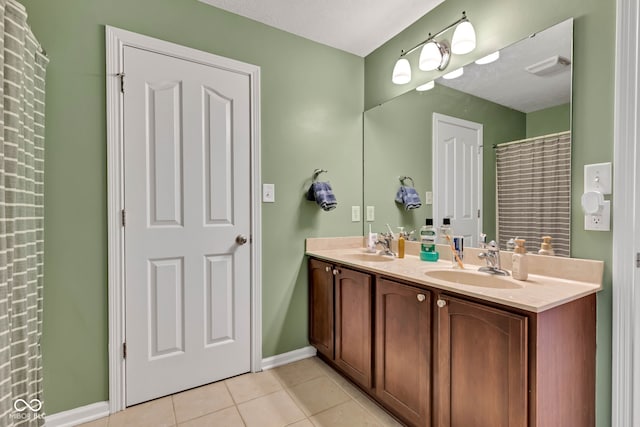705 Ridge Gate Dr, Brownsburg, IN 46112 - bathroom with double vanity and tile patterned floors