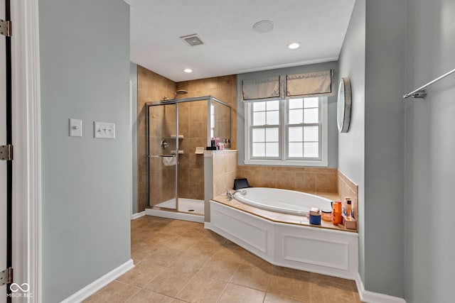 705 Ridge Gate Dr, Brownsburg, IN 46112 - full bath featuring a garden tub, a shower stall, tile patterned floors, and recessed lighting