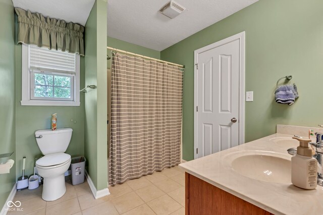 705 Ridge Gate Dr, Brownsburg, IN 46112 - bathroom featuring double vanity, tile patterned floors, and curtained shower