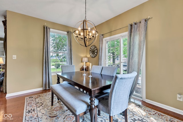 705 Ridge Gate Dr, Brownsburg, IN 46112 - dining area with a chandelier and wood finished floors