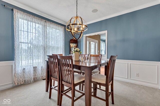 705 Ridge Gate Dr, Brownsburg, IN 46112 - dining area with carpet flooring, a chandelier, ornamental molding, a decorative wall, and wainscoting
